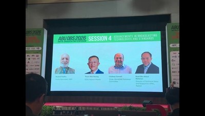 The stage at ABU DBS 2026 with a screen showing headshots of session speakers including Lindsay Cornell, WorldDAB
